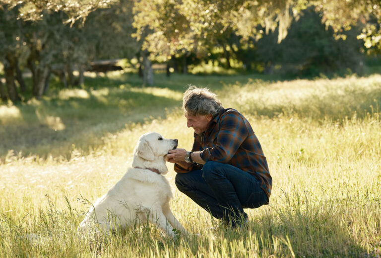Coach Stephen Mcghee and Dog at Home at the Ranch by Doug Ellis