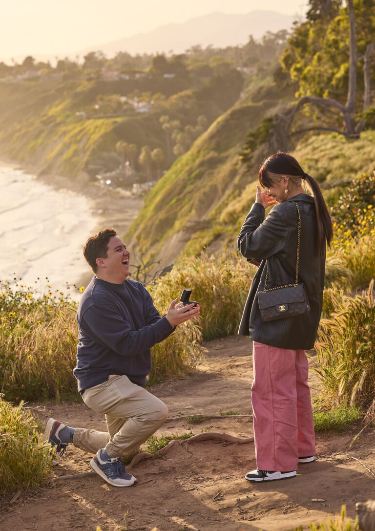 Man proposing to fiance near beach in santa barbara.