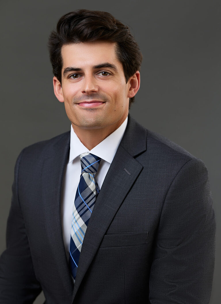 professional business headshot on gray background