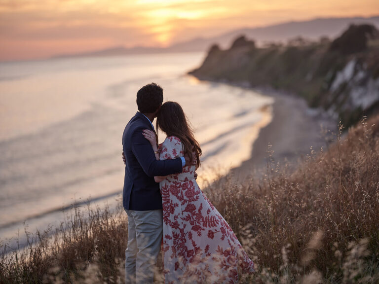 Couples engagement photo on bluff in Goleta