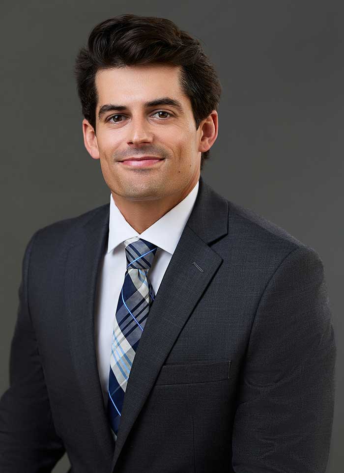 business-headshot-on-gray-background